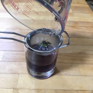 Violets being strained out - Violet Syrup - - Pippin & Gile - Bushcraft and Foraging - South London - South Wales - Mid Wales - Brecon Beacons National Park - Surrey