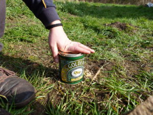 Pushing down the lid for a tight fit - Charcoal Making - Pippin & Gile Bushcraft Courses and Foraging Courses