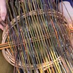 a finished pre trimmed tension platter with very skinny rods and a wide range of colours - made on our Progressive Basket Weaving experience