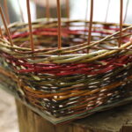 a close up of the willow weaving in a plank basket.