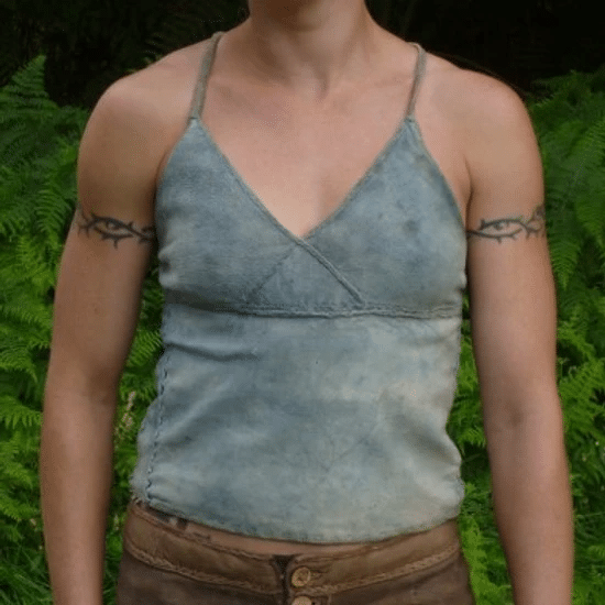 a leather vest top with bust detailing in a sky blue with leather shorts just showing
